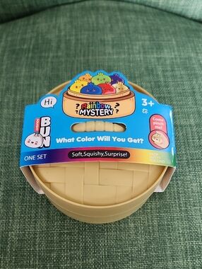 Rainbow Mystery Squishy Bun Toy In Steamer Container